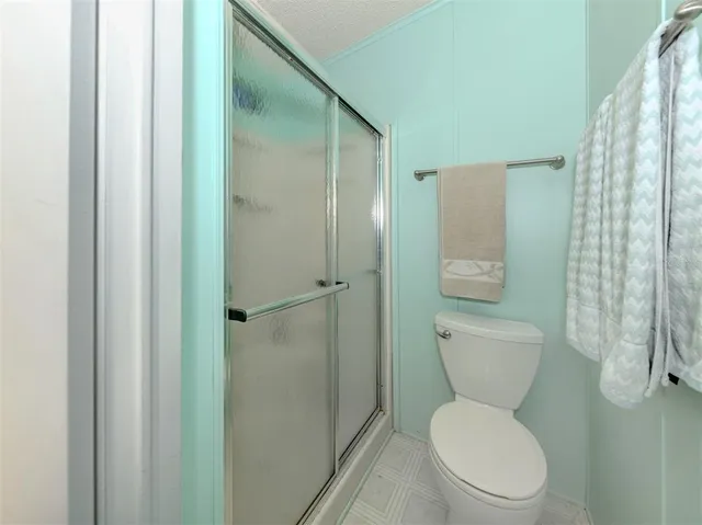 a living room with furniture and a glass door