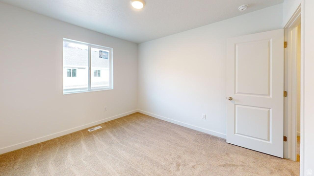 783 Pheasantbrook Drive, Unit 2A Centerville, UT 84014 - Photo 23 of 41 Room featuring neutral tone carpeting and white walls