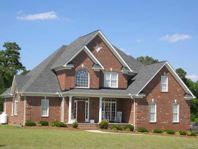 1025 Bellewood Farms Road Raleigh, NC 27603 - Photo 1 of 1 front view of a house with a yard