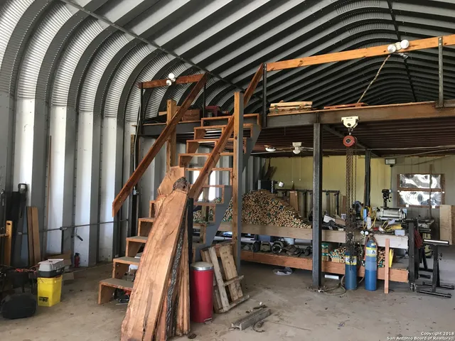 a view of a chairs and table in the patio