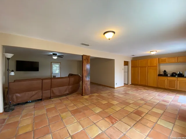 a bathroom with a sink toilet and a mirror
