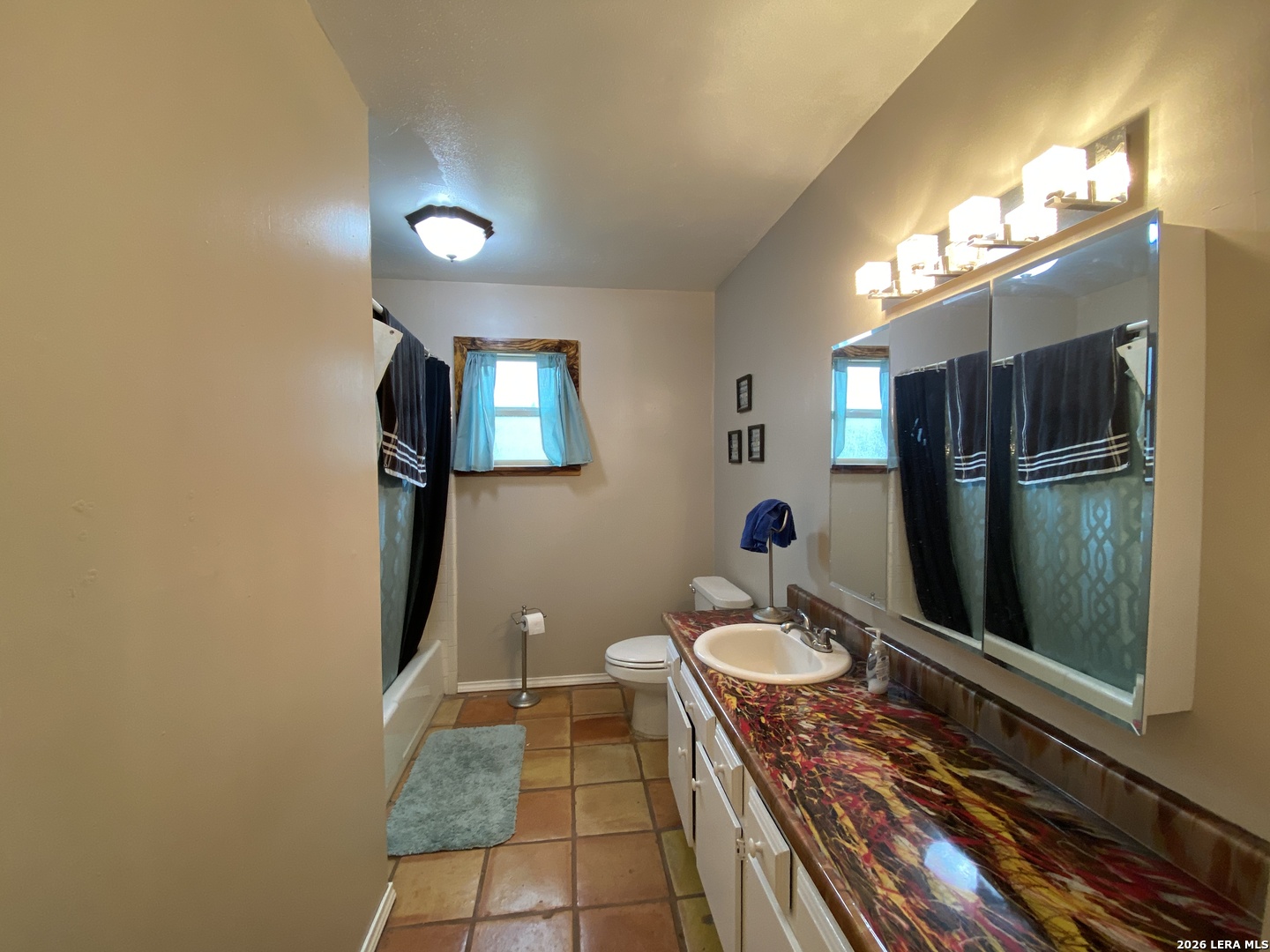 60 Wisdom Road Pleasanton, TX 78064 - Photo 15 of 29 a bathroom with a sink toilet and a mirror