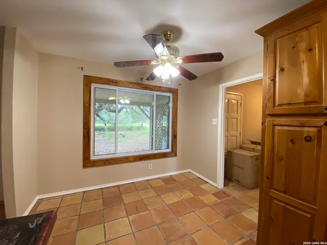 a kitchen with granite countertop a refrigerator and a stove