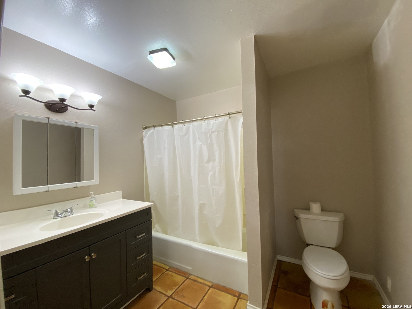 60 Wisdom Road Pleasanton, TX 78064 - Photo 27 of 29 a bathroom with a sink a toilet a mirror and shower
