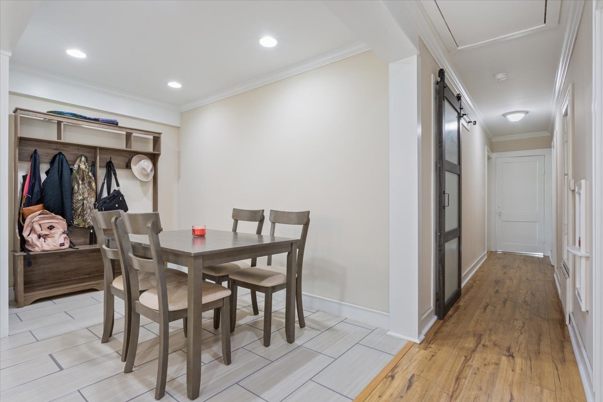 1607 North Harding Avenue Cameron, TX 76520 - Photo 11 of 37 Recessed lighting illuminates this versatile dining area featuring tile flooring and a functional hall tree.
