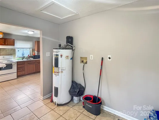 a kitchen with a refrigerator and washer