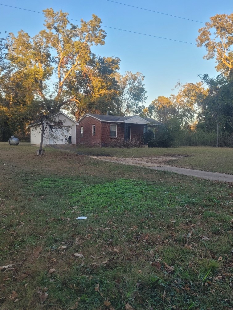 a backyard of a house with lots of green space