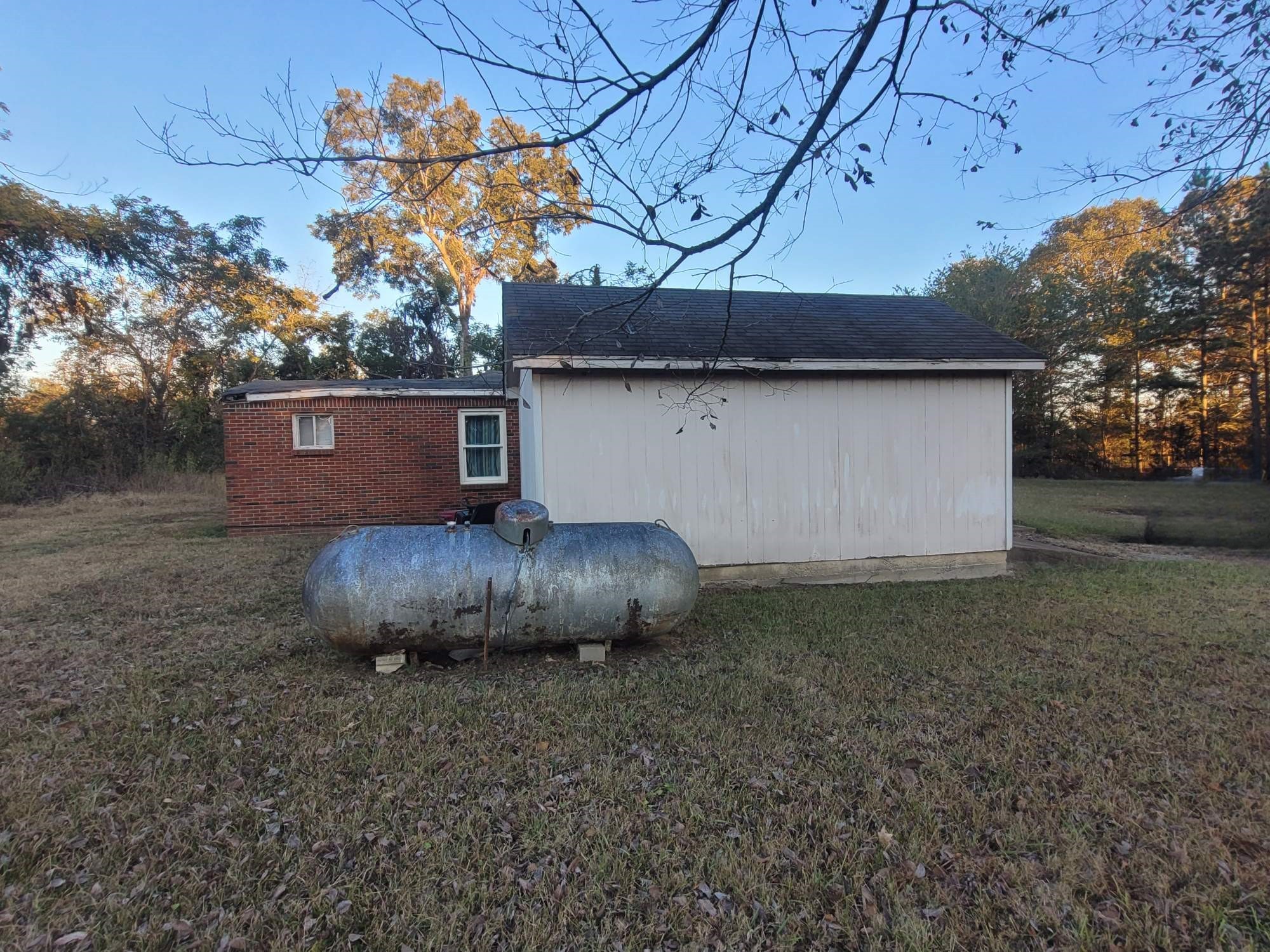 12586 Macon Road Collierville, TN 38017 - Photo 6 of 7 a backyard of a house with lots of plants and outdoor seating