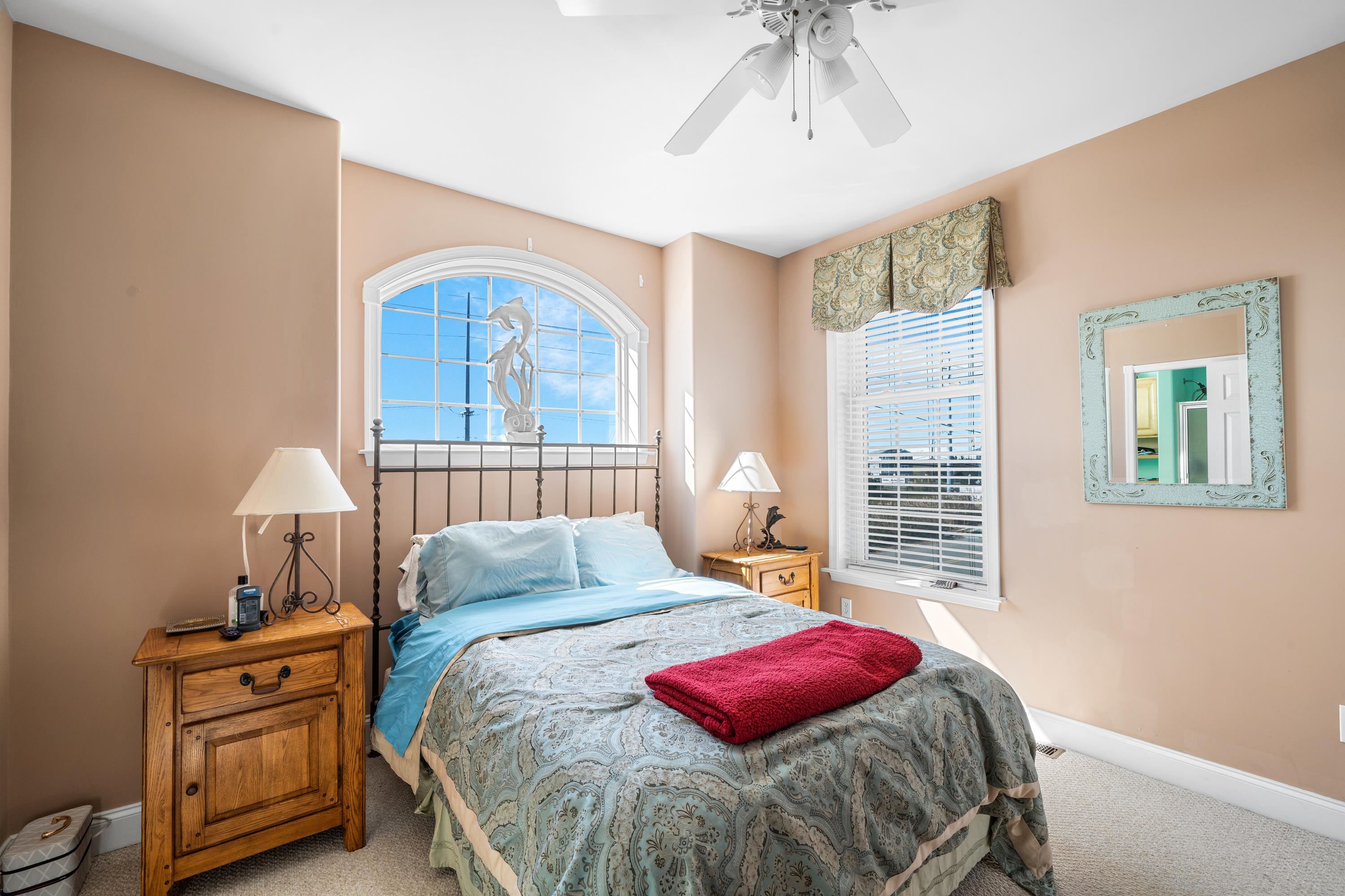 448 Avalon Avalon, NJ 08202 - Photo 11 of 32 a bedroom with a bed and a window