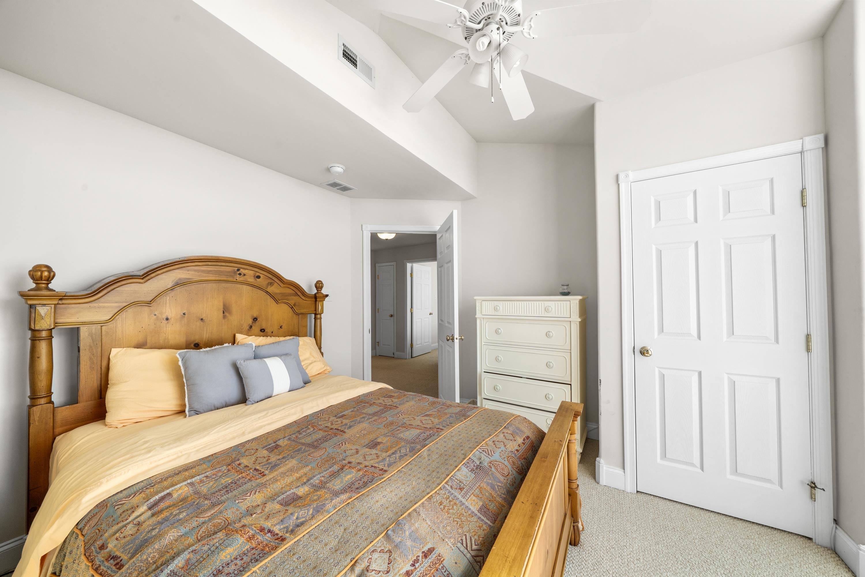 448 Avalon Avalon, NJ 08202 - Photo 13 of 32 a bedroom with a bed and a mirror