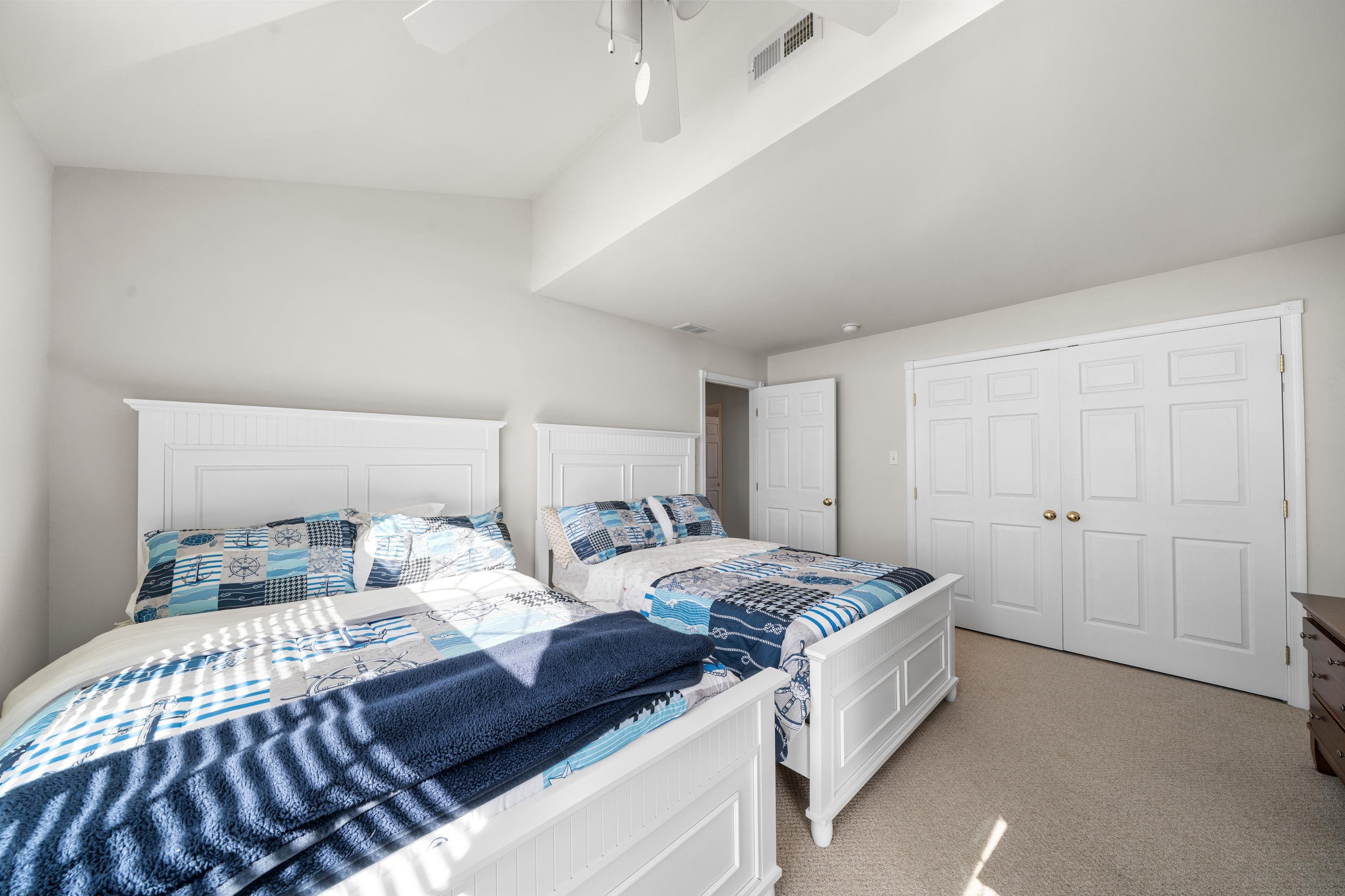 448 Avalon Avalon, NJ 08202 - Photo 25 of 32 a large bedroom with a bed and a cabinets