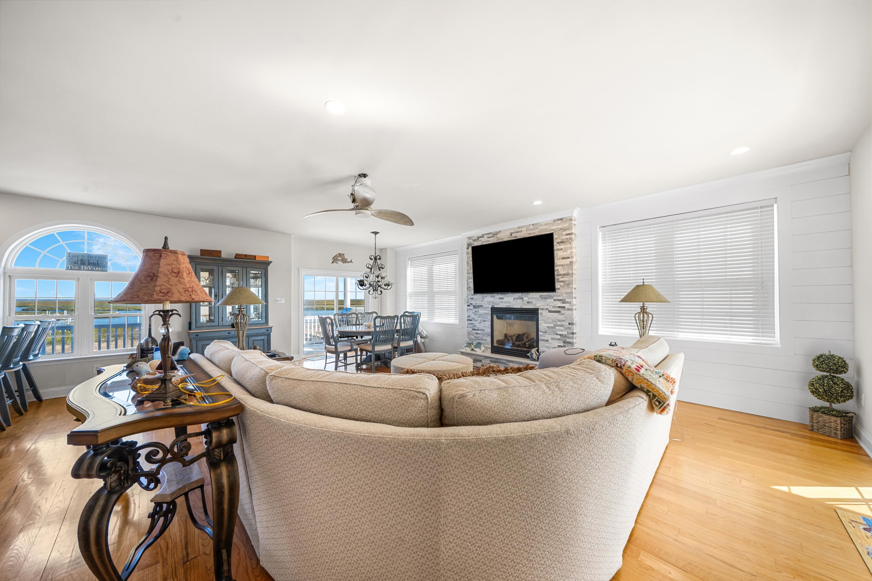 448 Avalon Avalon, NJ 08202 - Photo 30 of 32 a living room with fireplace furniture and a flat screen tv