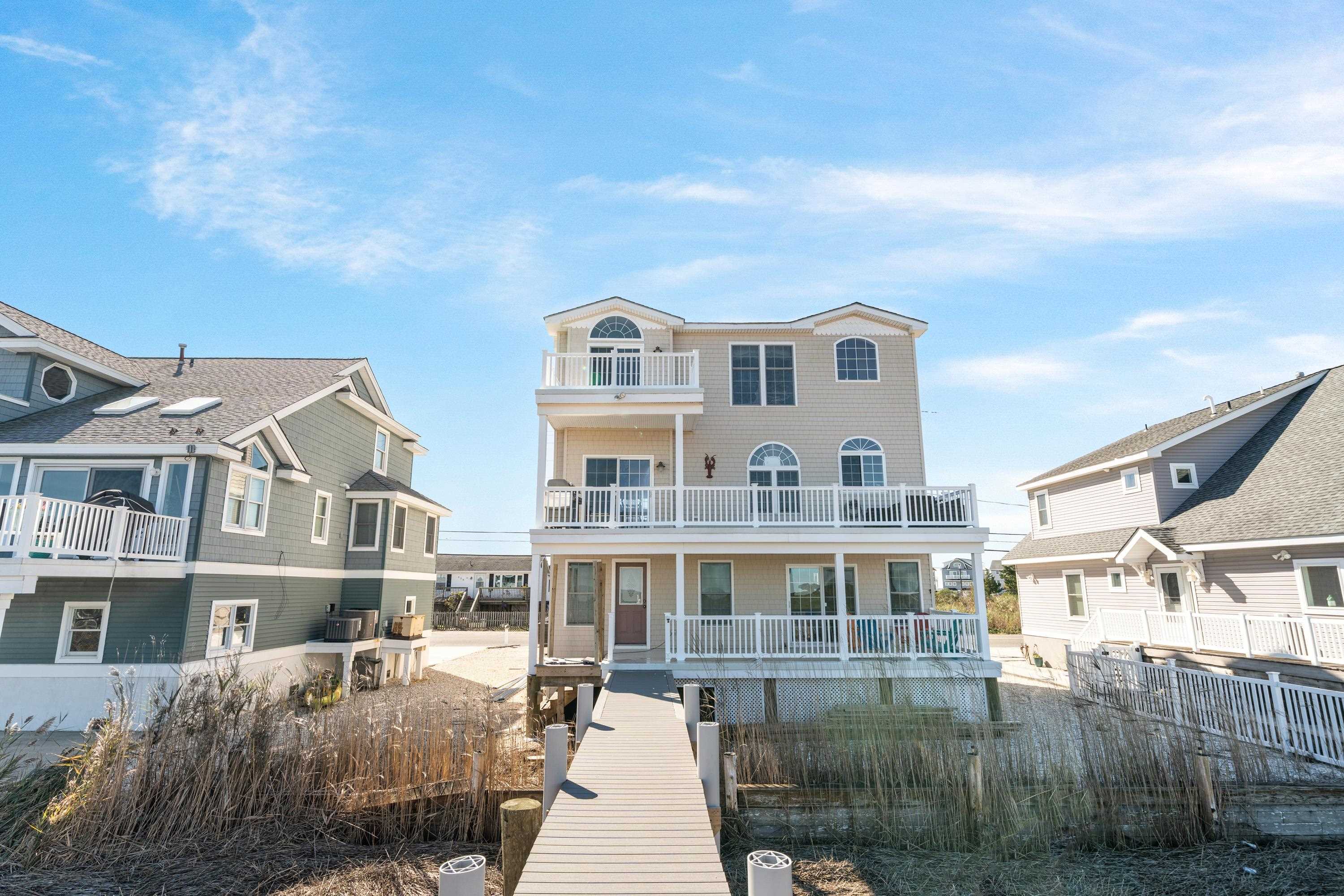 448 Avalon Avalon, NJ 08202 - Photo 32 of 32 a front view of a house with a yard