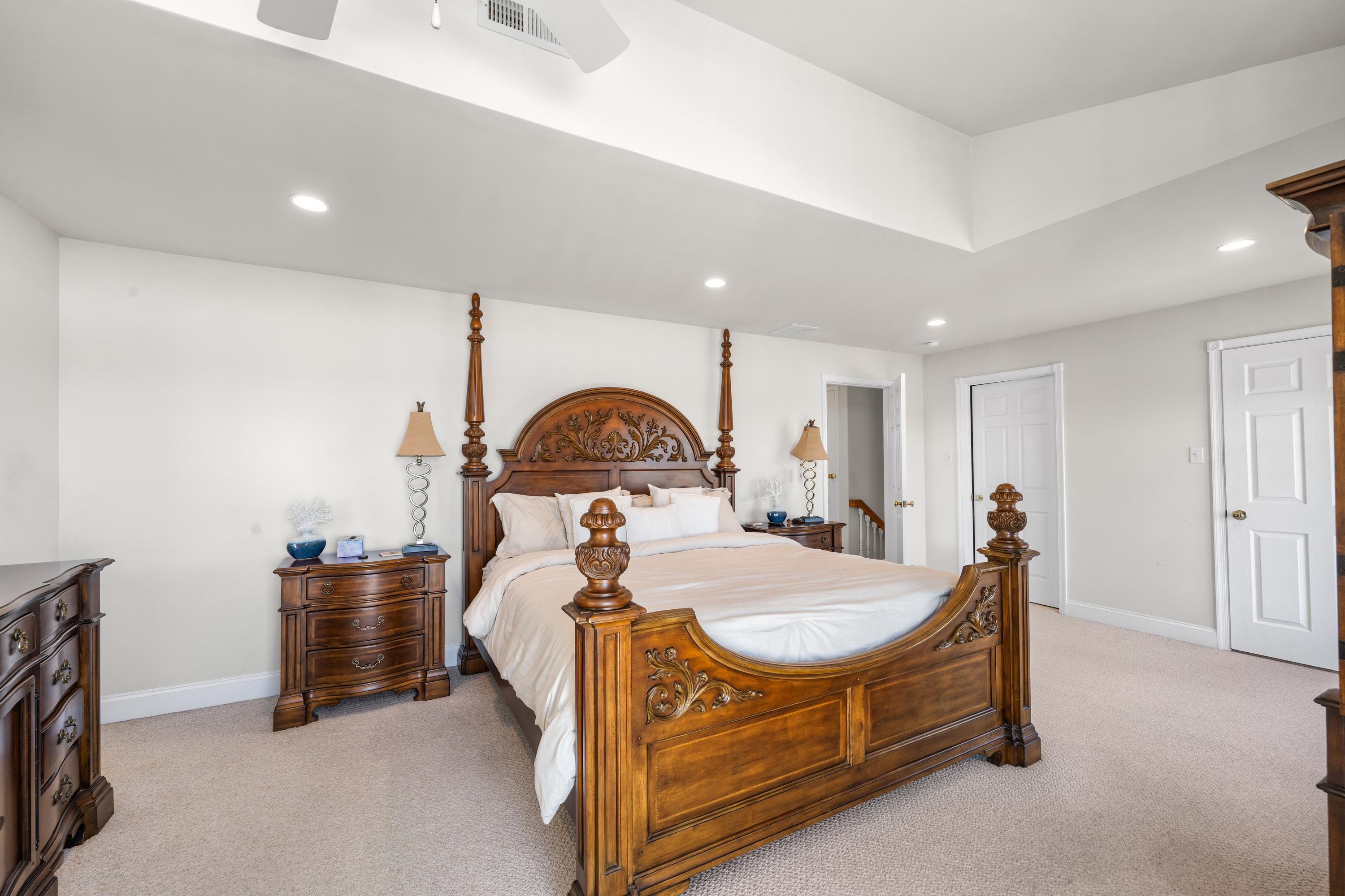 448 Avalon Avalon, NJ 08202 - Photo 6 of 32 a bed room with a bed and a chandelier