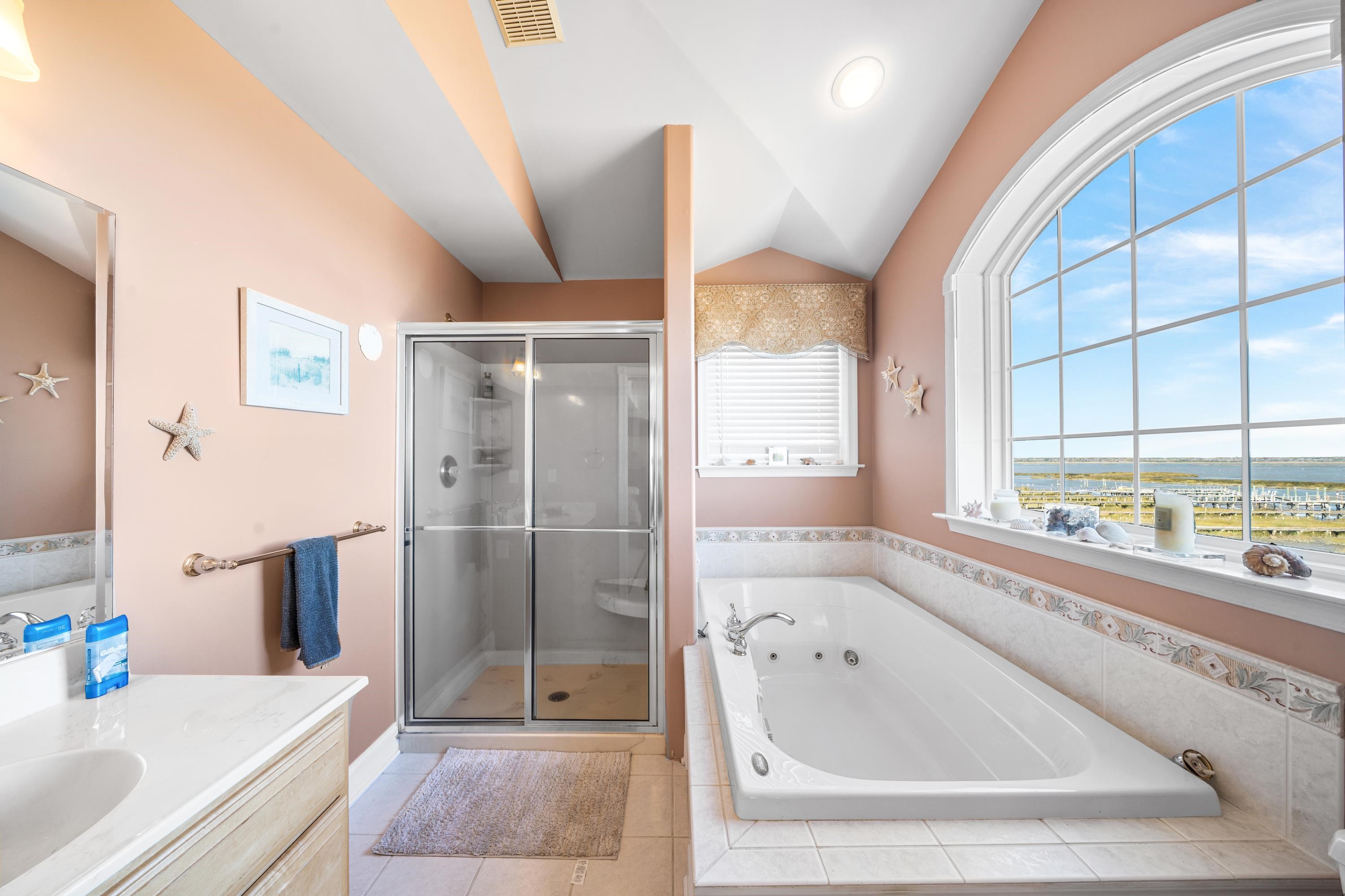 448 Avalon Avalon, NJ 08202 - Photo 7 of 32 a bathroom with a tub sink and shower