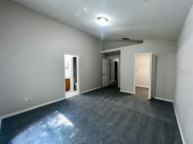 an empty room with closet area