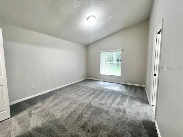 a view of a hallway with a bathroom