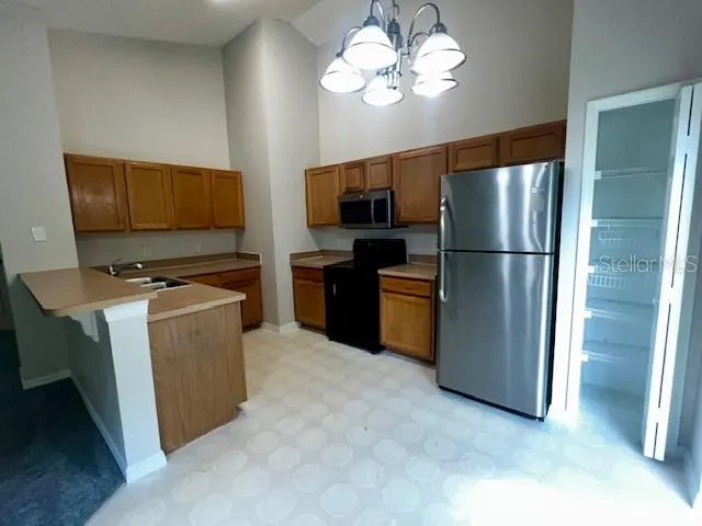 a kitchen with a stove and a sink