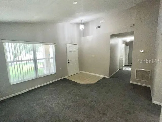 a white house that has a tree in front of it