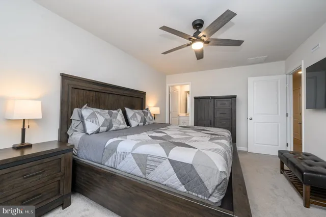 a bedroom with bed and window