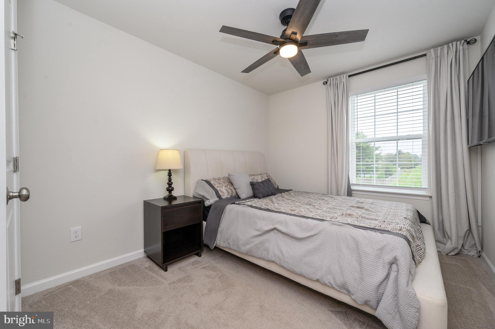 40 Nelsons Way Westampton, NJ 08060 - Photo 21 of 34 a bedroom with a bed and a ceiling fan