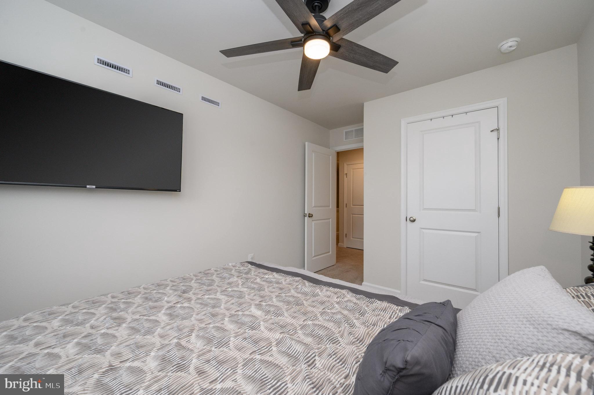 40 Nelsons Way Westampton, NJ 08060 - Photo 22 of 34 a bedroom with a bed and a flat screen tv