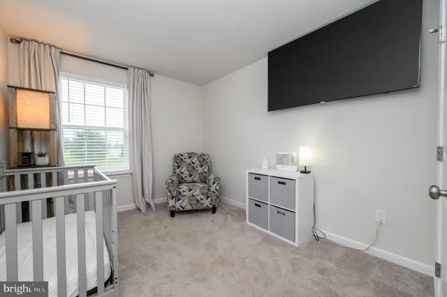 a view of a livingroom with furniture and a window