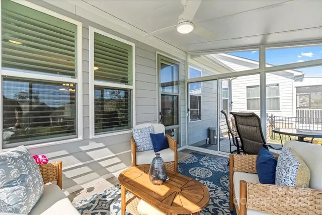 a living room with furniture rug and window