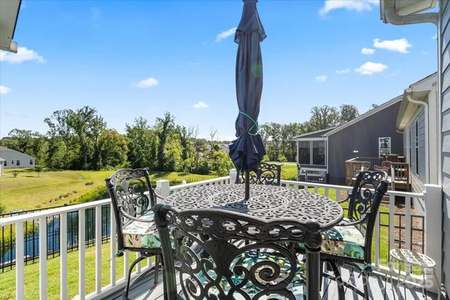 a view of a patio with a table and chairs