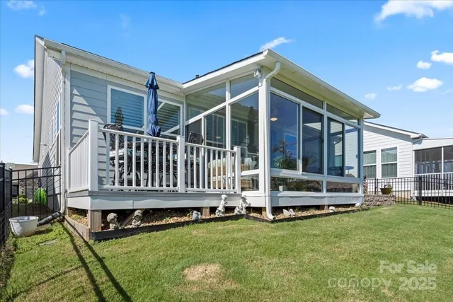 a backyard of a house with barbeque oven and garden