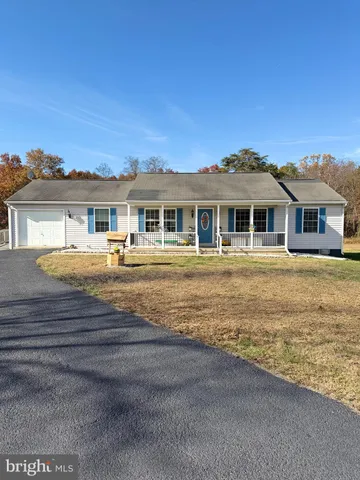 a front view of a residential apartment building with a yard