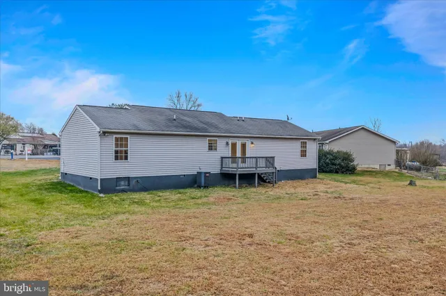 an aerial view of a house with outdoor space
