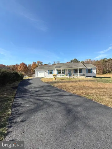 a view of house with ocean view
