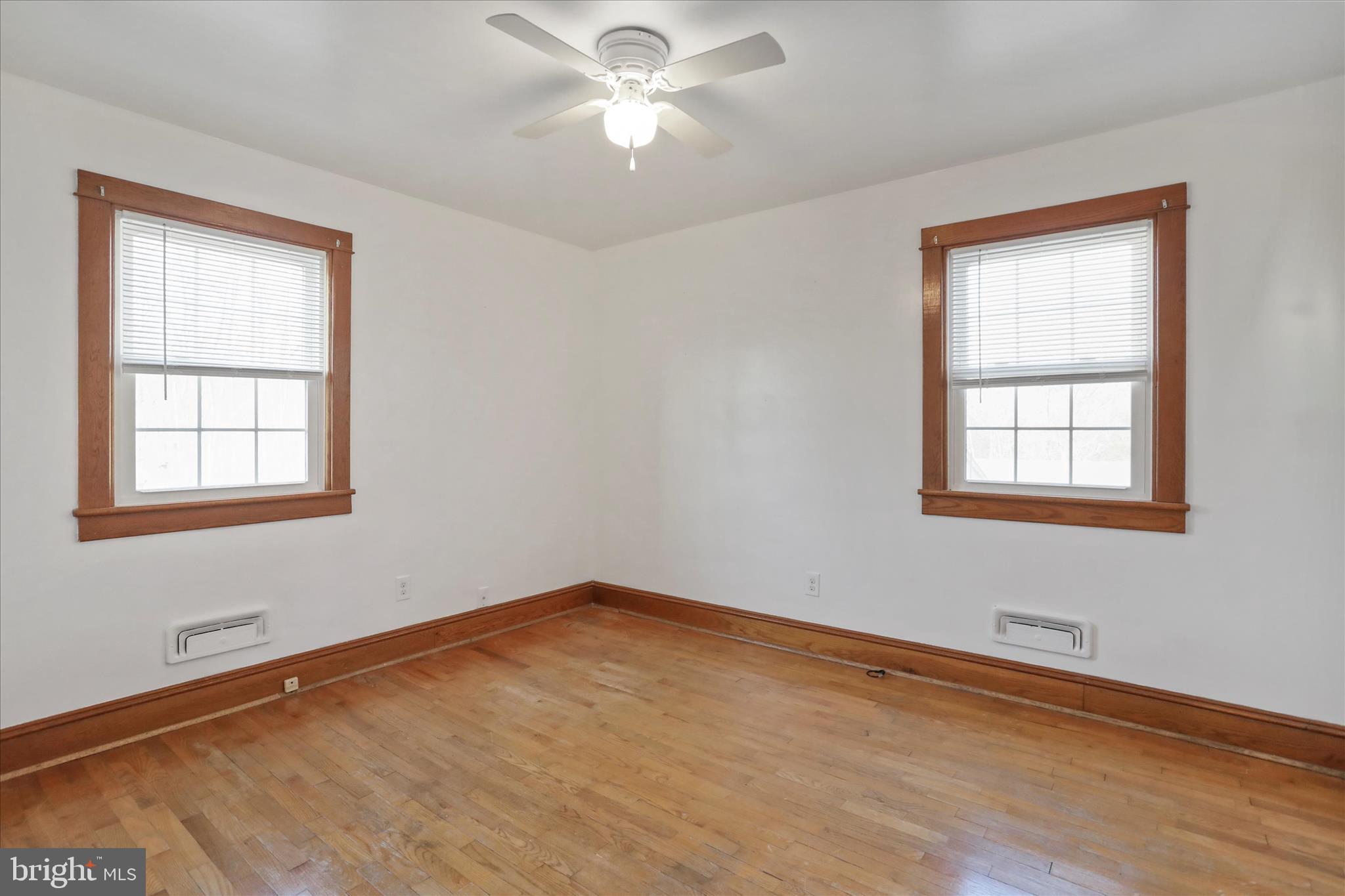 1064 Strasburg Road Front Royal, VA 22630 - Photo 20 of 48 a view of a room with wooden floor and windows