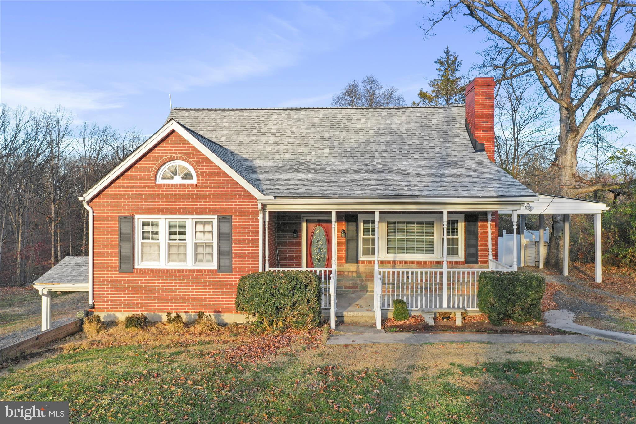 1064 Strasburg Road Front Royal, VA 22630 - Photo 5 of 48 a front view of a house with a yard