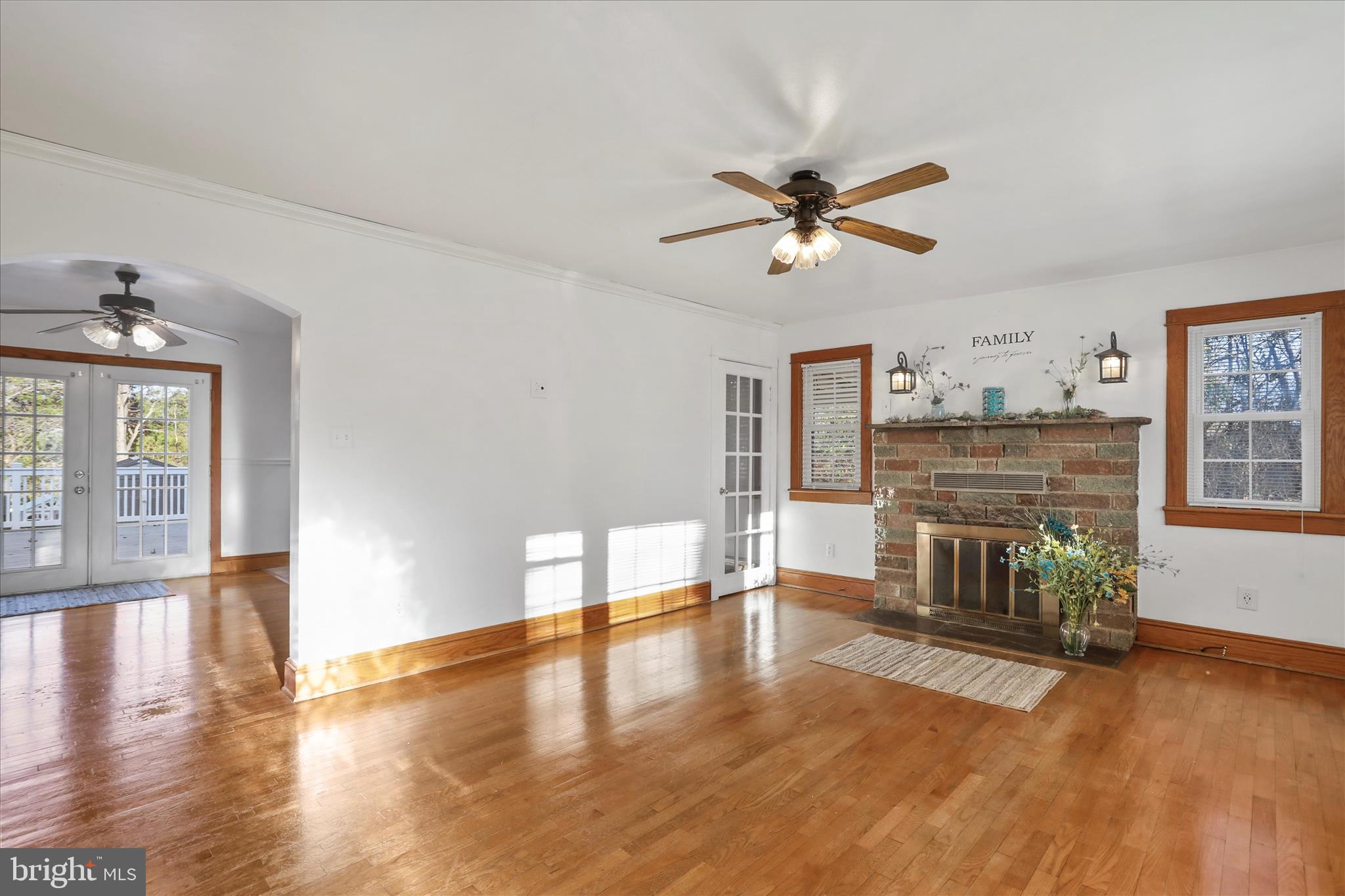 1064 Strasburg Road Front Royal, VA 22630 - Photo 8 of 48 a living room with fireplace furniture and a wooden floor