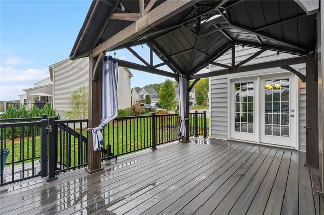 a view of a balcony with wooden floor