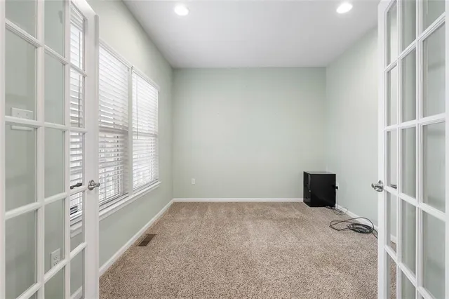 a view of an empty room with a window