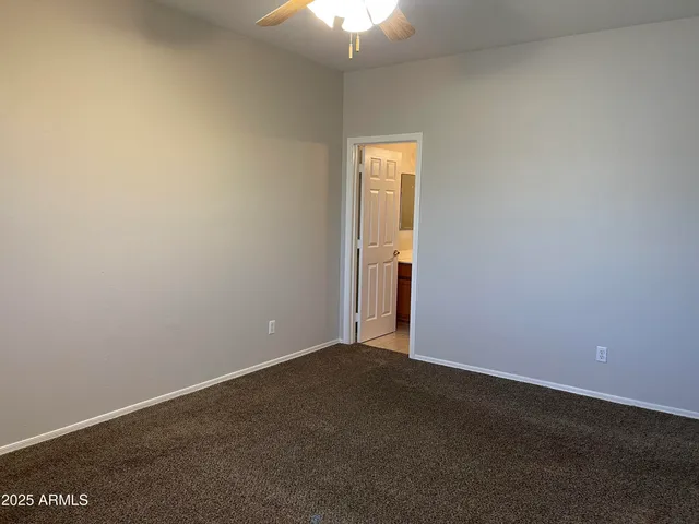 a bathroom with a sink toilet vanity and shower