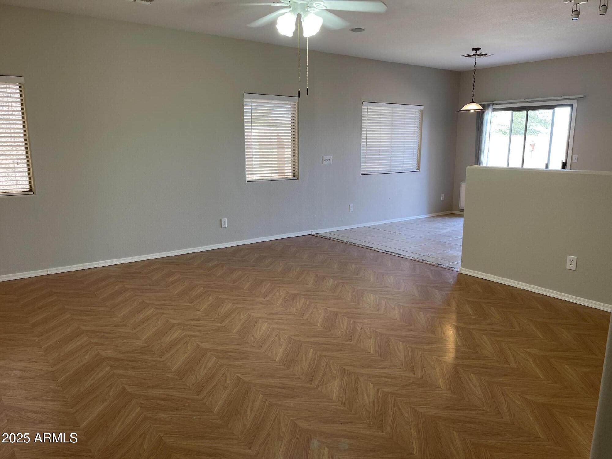 1426 East Ave Isabela Casa Grande, AZ 85122 - Photo 4 of 24 a view of an empty room with window and chandelier fan