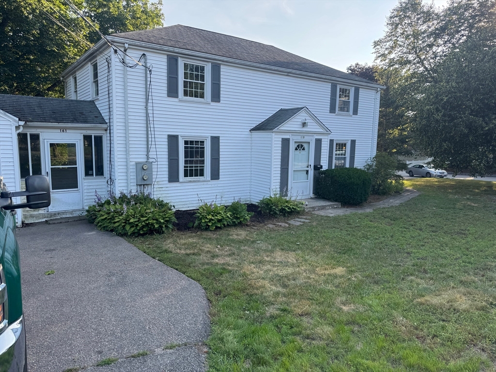 161 Hunnewell Street, Unit 1 Needham, MA 02494 - Photo 13 of 13 a view of a house with garden and yard