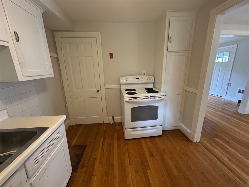 161 Hunnewell Street, Unit 1 Needham, MA 02494 - Photo 7 of 13 a kitchen with a stove oven and sink