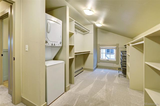 a view of a kitchen with furniture and flat screen tv