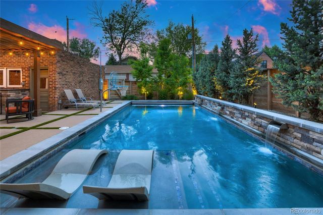 a outdoor space with patio the couches and a dining table with the view of the house