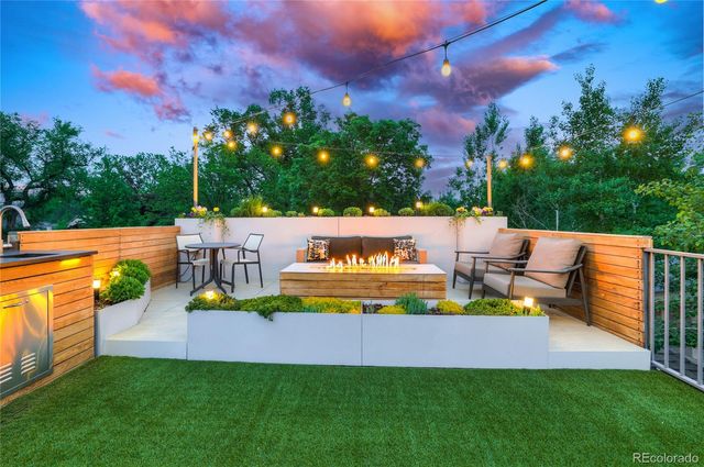 a outdoor space with patio lots of furniture and iron fence