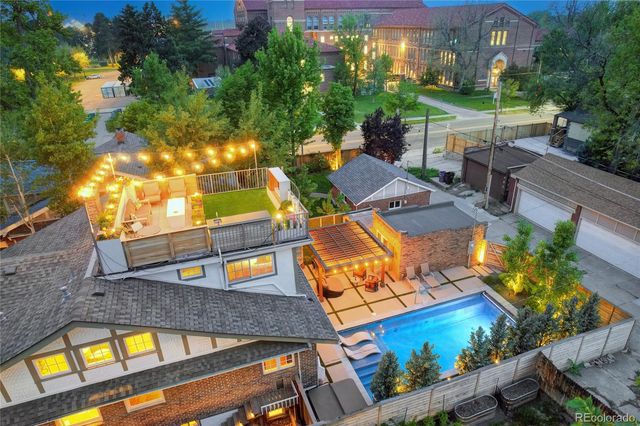 an aerial view of a house with outdoor space