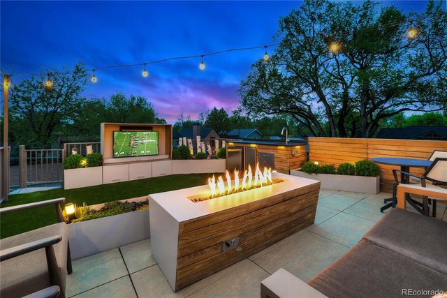 a living room with furniture a wooden floor and a table