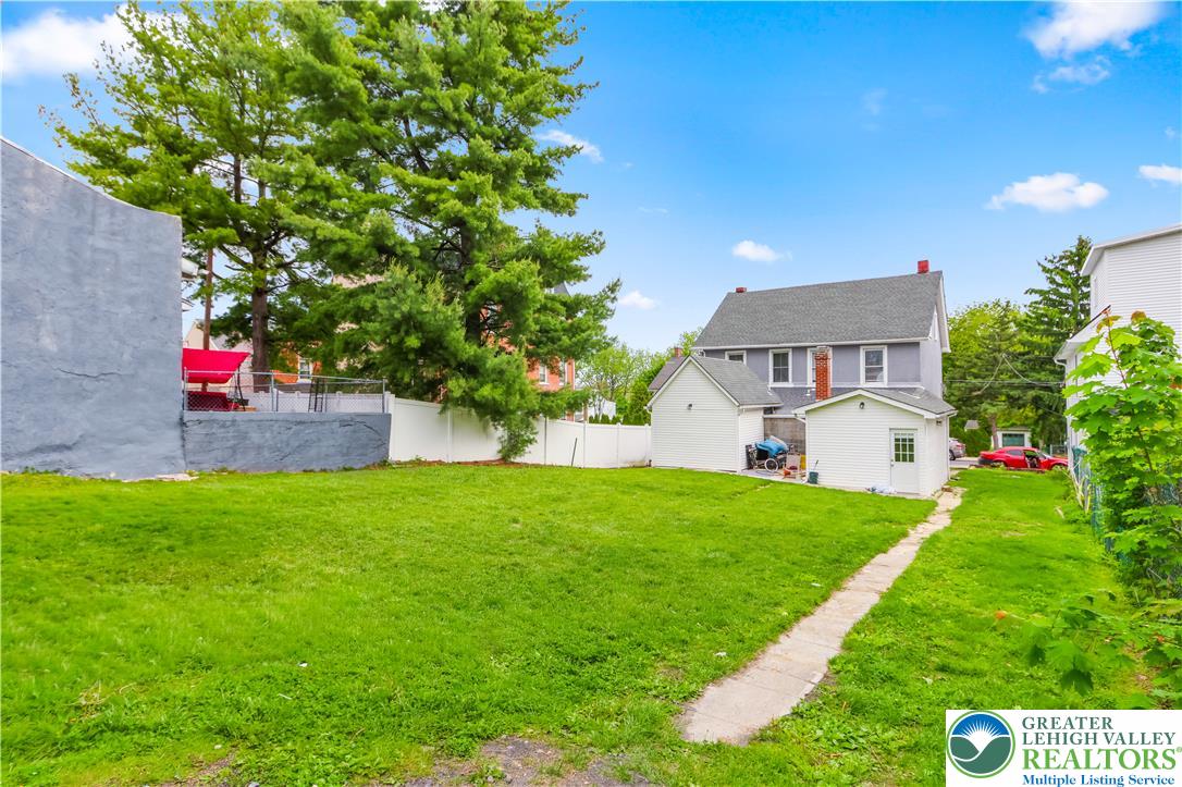 12 South Front Street Coplay, PA 18037 - Photo 34 of 41 This spacious grassy yard offers ample room for outdoor activities and future enhancements.