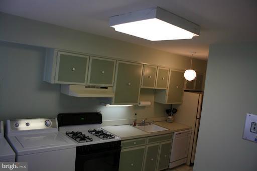 9822 Georgia Avenue, Unit 19201 Silver Spring, MD 20902 - Photo 1 of 14 a kitchen with a stove and a refrigerator