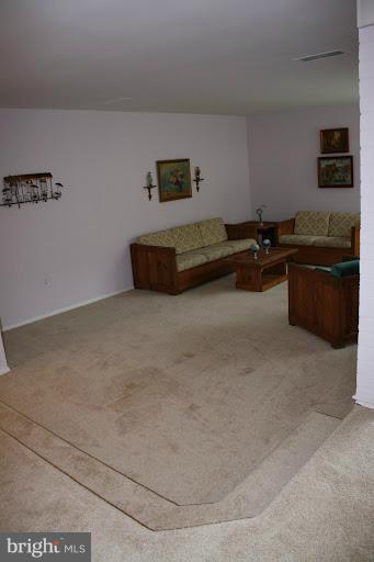 9822 Georgia Avenue, Unit 19201 Silver Spring, MD 20902 - Photo 7 of 14 a living room with furniture and a flat screen tv